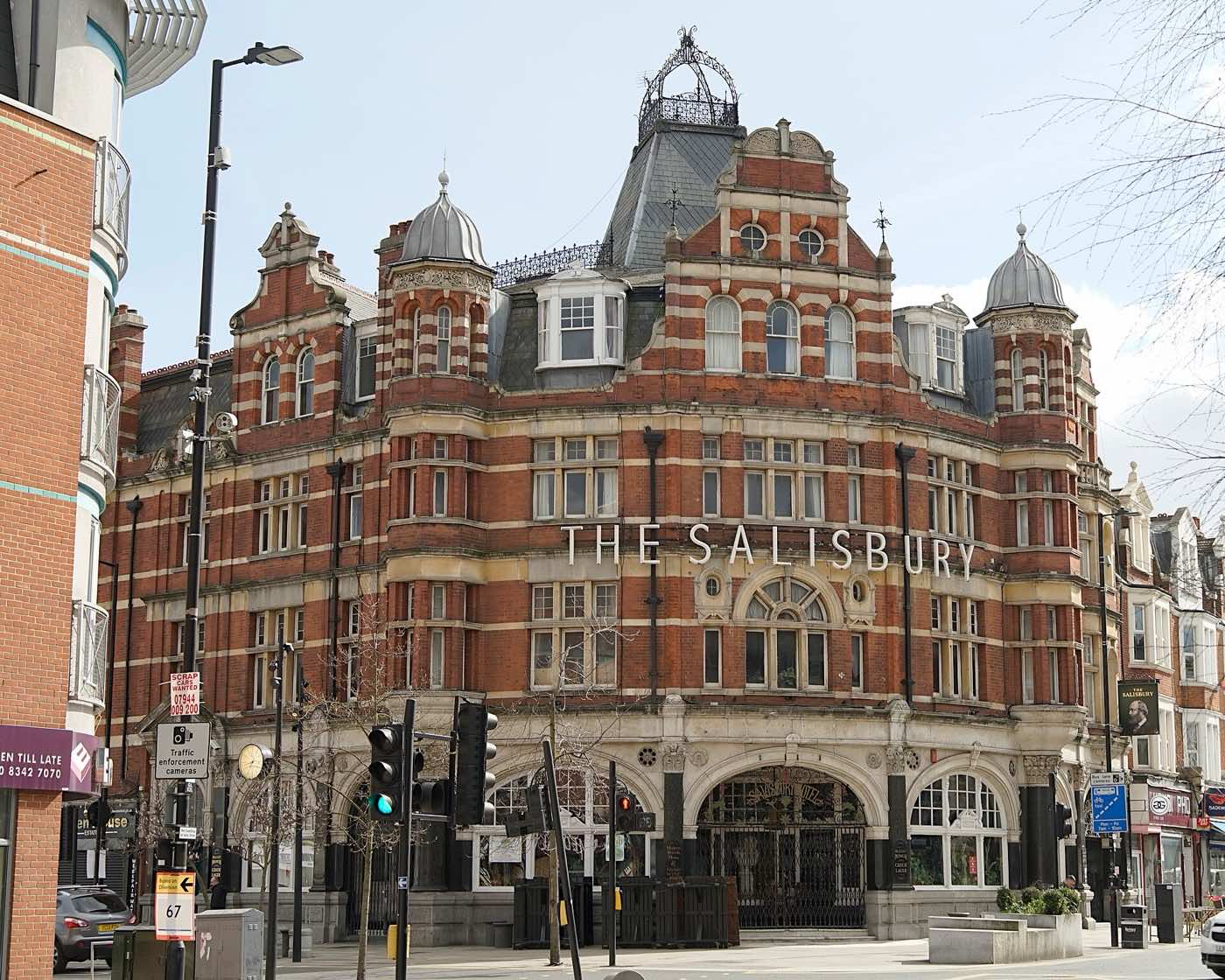 The Salisbury in Harringay: a large red-brick and stone corner pub with turrets, a domed tower and its name across the facade